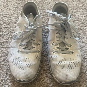 Well loved white and Gray Nike’s Women’s Sneakers. Size 7.